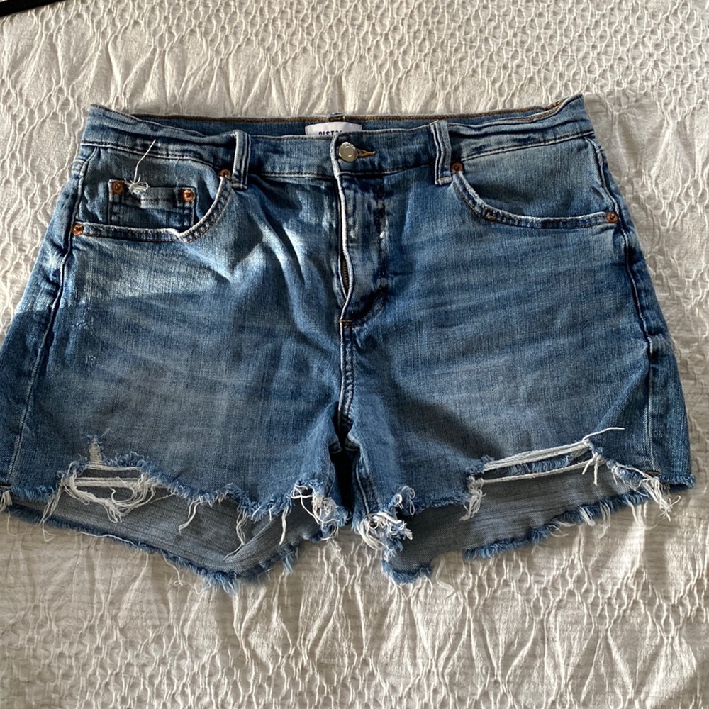 Distressed jean shorts by Pistola